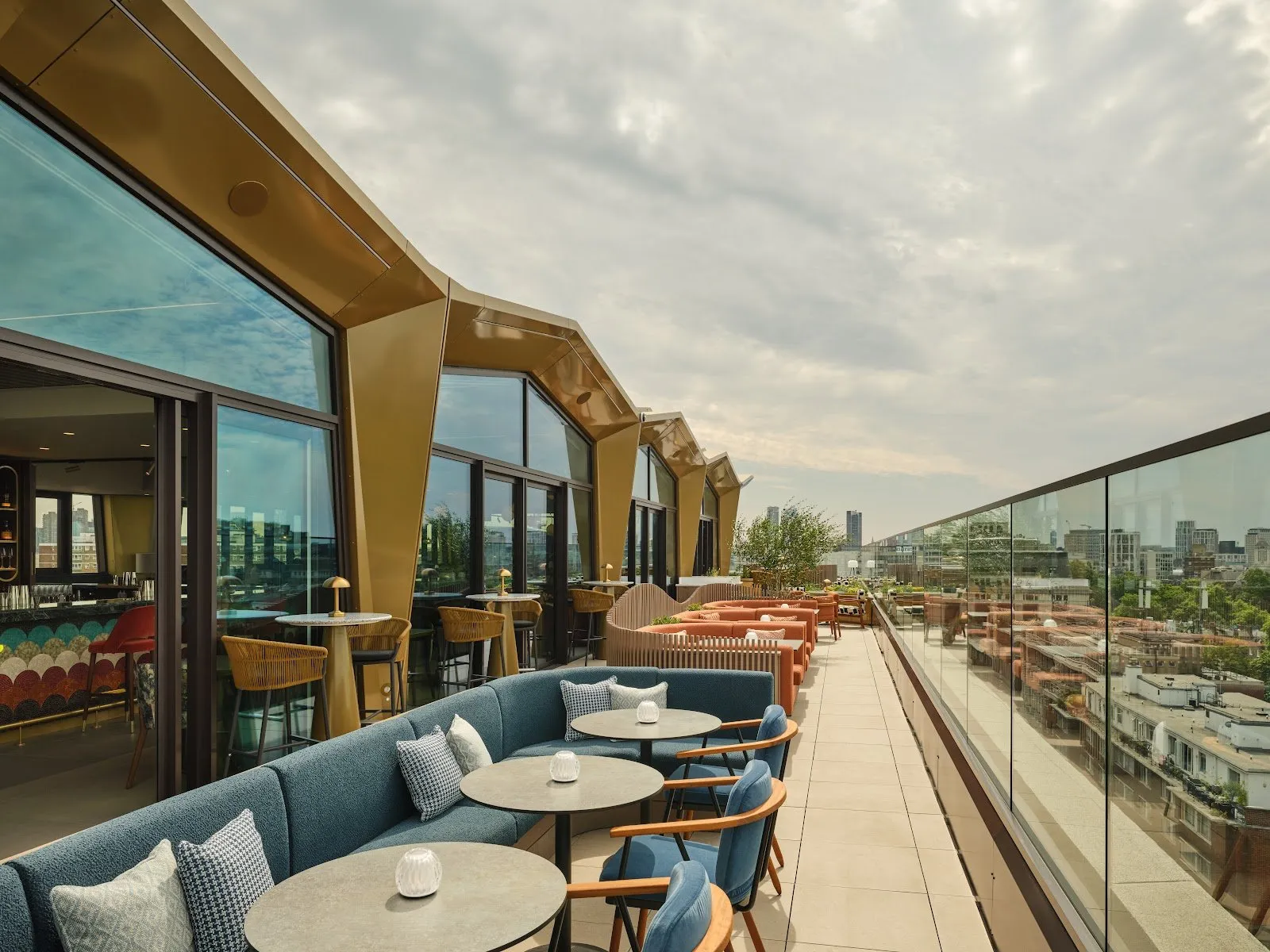 The glass-walled Arcus rooftop restaurant and terrace on the tenth floor of The Imperial overlooking the London skyline