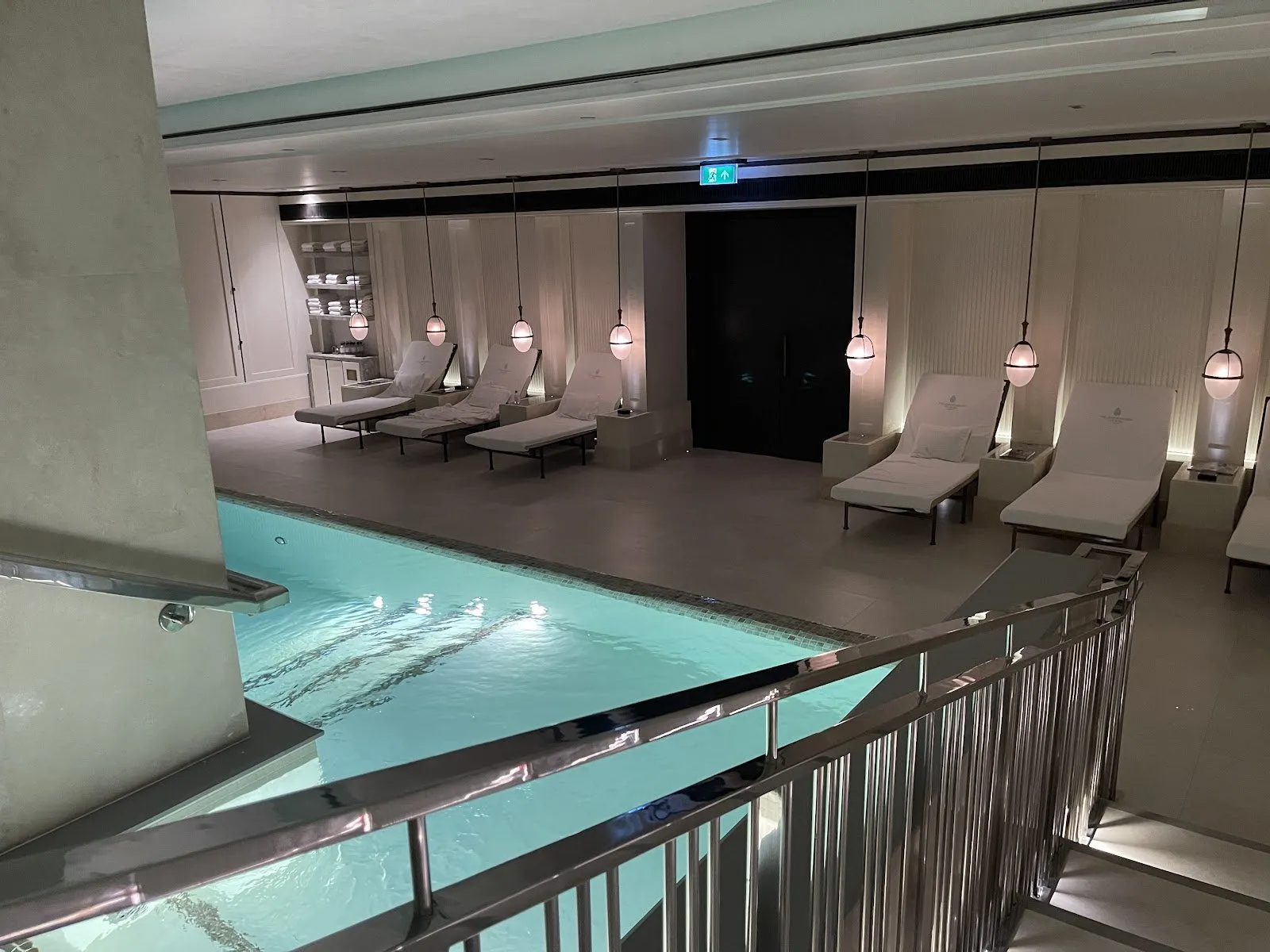 The subterranean hydrotherapy pool at The Lanesborough Club and Spa with daybeds and low architectural lighting