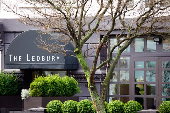 The dark green frontage of The Ledbury on Ledbury Road, with its name lettered on the awning