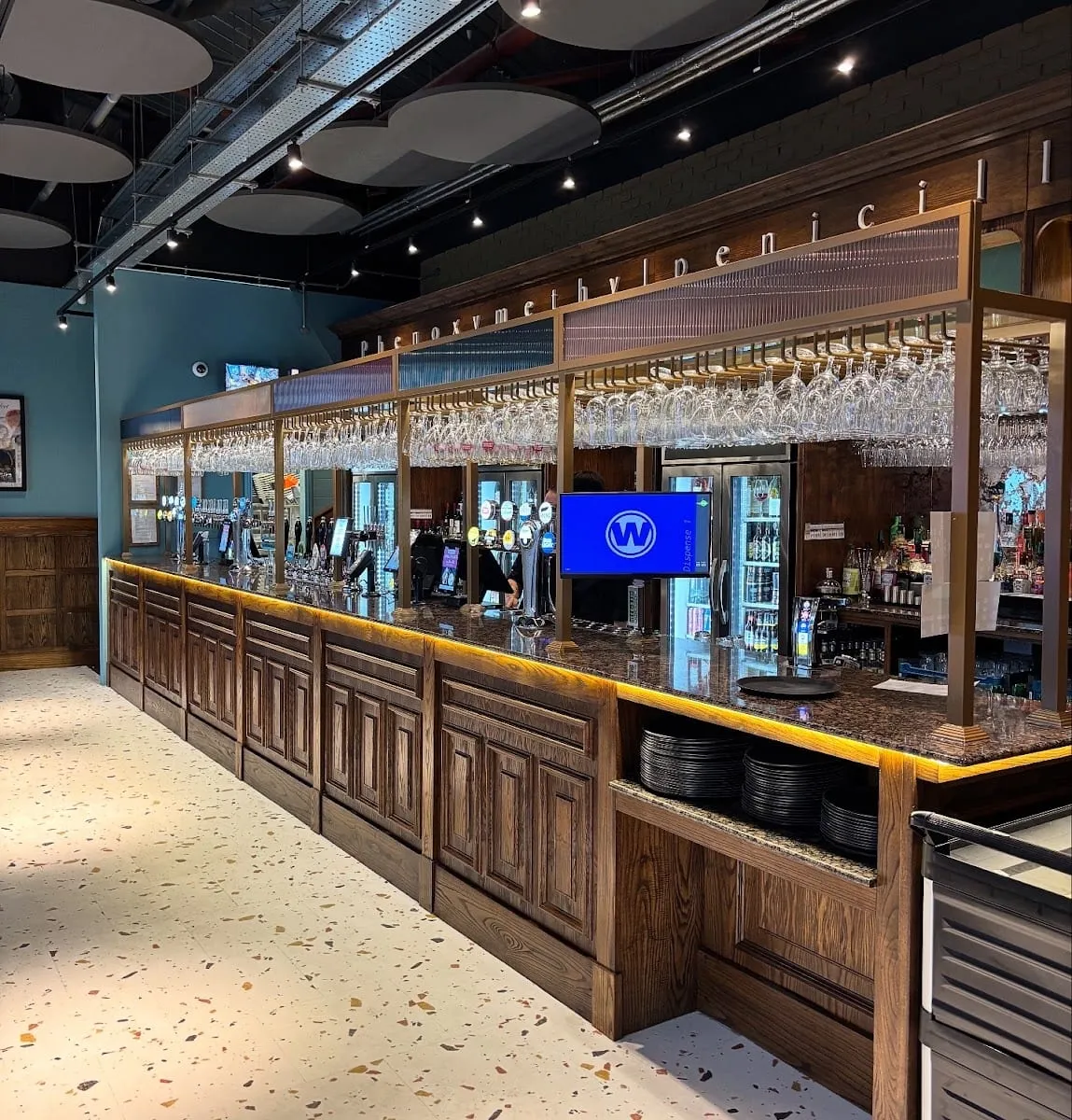 The bar inside The Sir Alexander Fleming, with phenoxymethylpenicillin spelled out in large letters above the taps