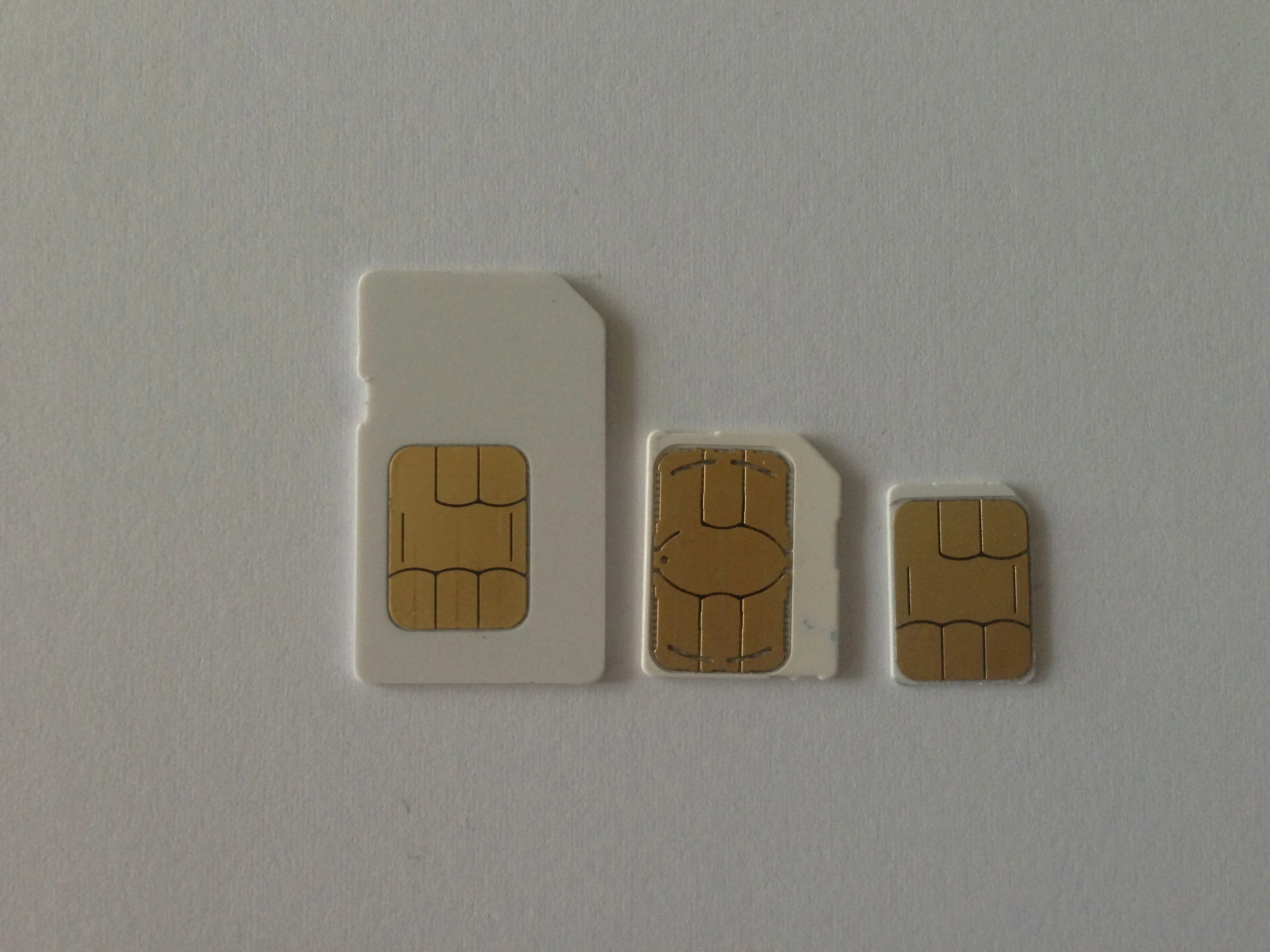 Full-size, mini, micro and nano SIM cards arranged side by side