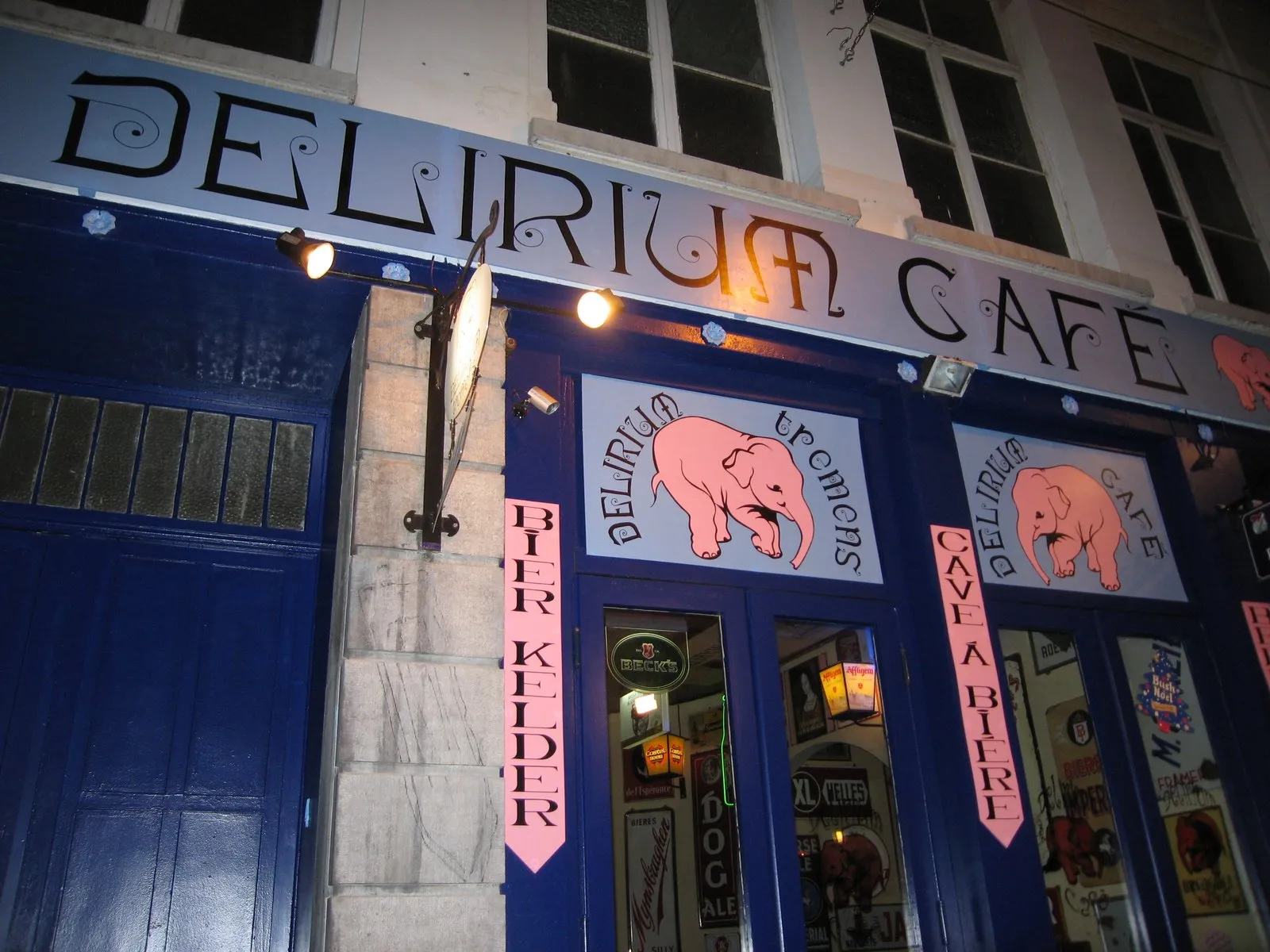 The Delirium Café's sign and pink-elephant logo above its doorway in Brussels