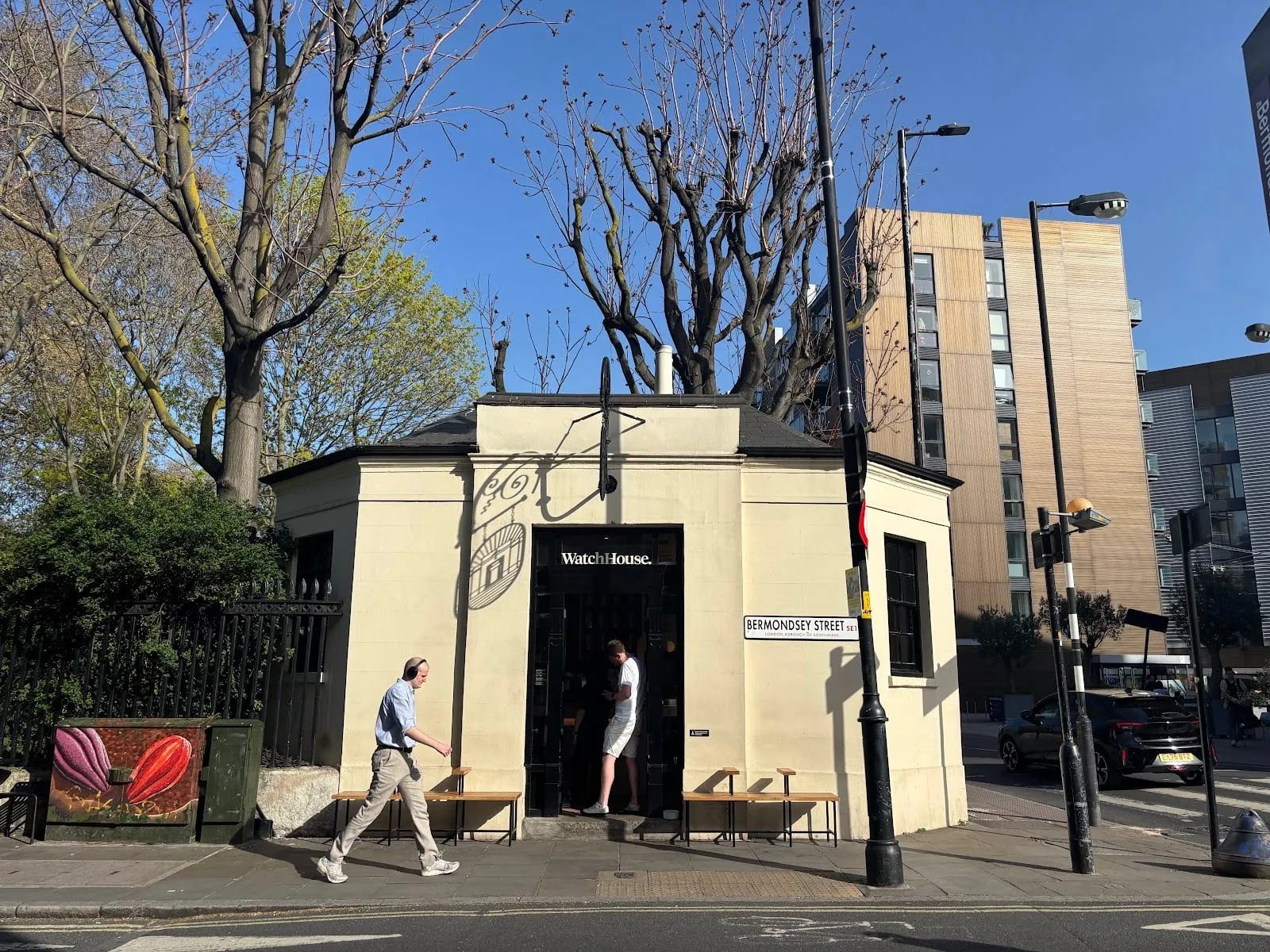 The small cream-painted watchman's hut on Bermondsey Street housing the original WatchHouse, with its sign over the door